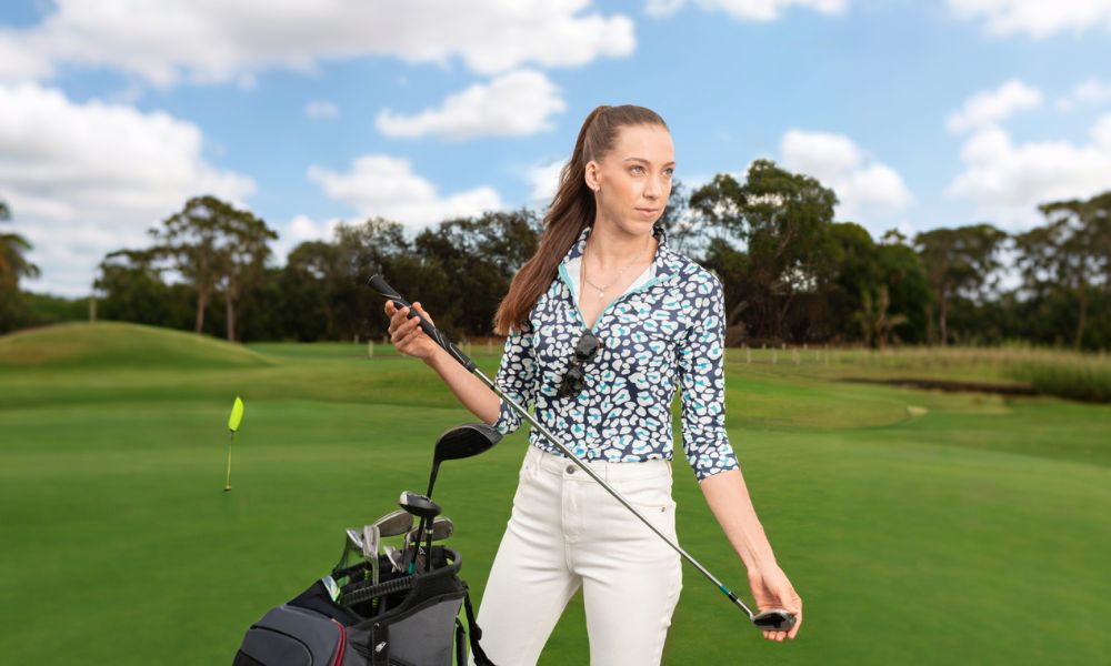 Women wear blue collared polo shirt with white pants